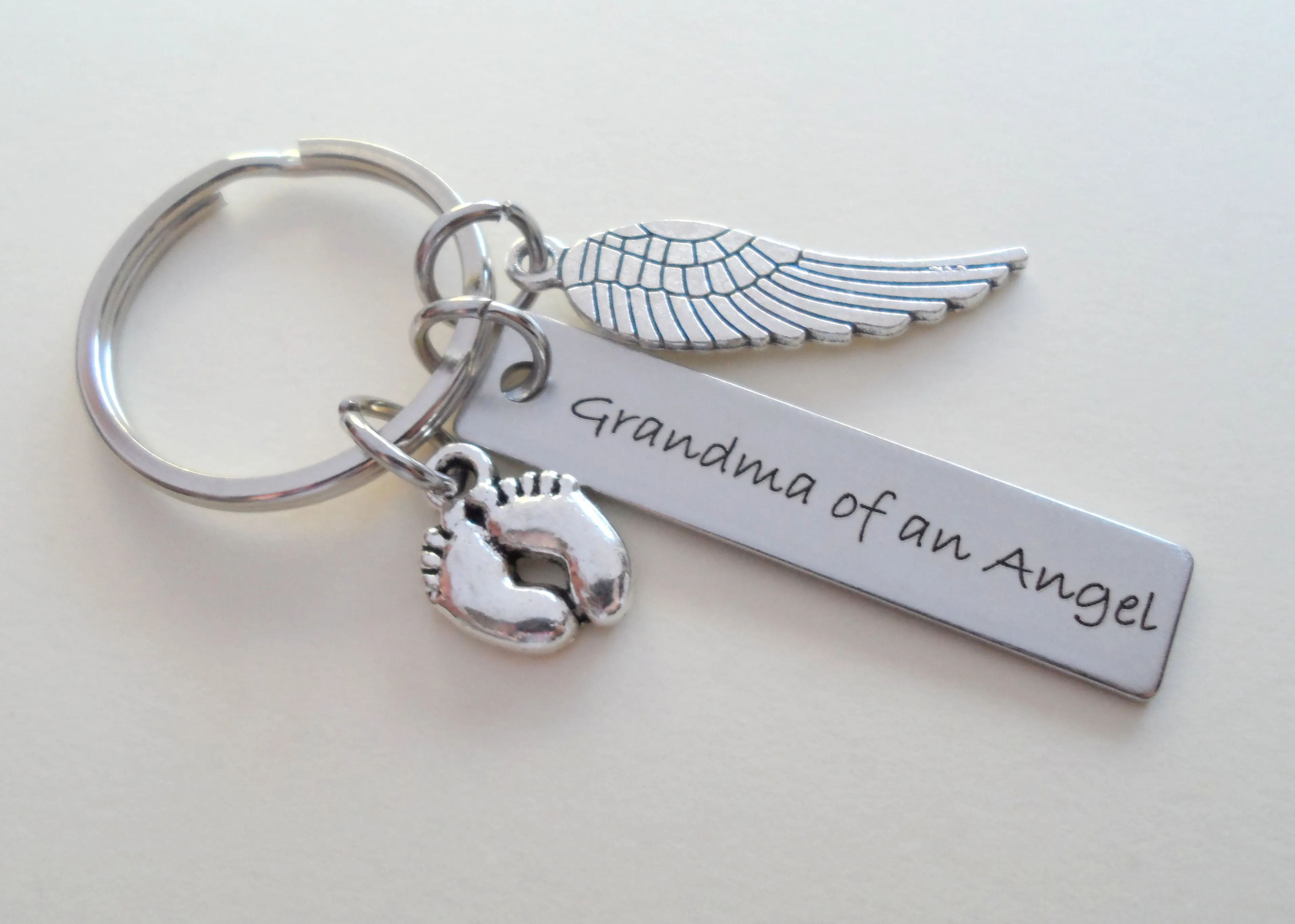Grandma of an Angel Engraved Keychain, Baby Memorial Keychain, Wing Charm and Baby Feet Charm