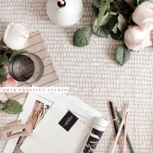 Water, Roses & Pencils on Patterned Tablecloth, Stock Image
